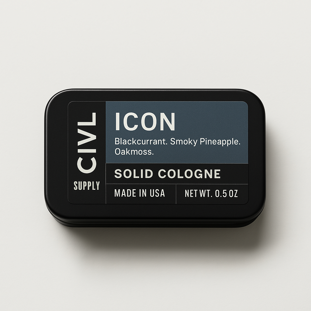 A small, rectangular tin container labeled 'ICON Solid Cologne' with the text 'Blackcurrant, Smoky Pineapple, Oakmoss