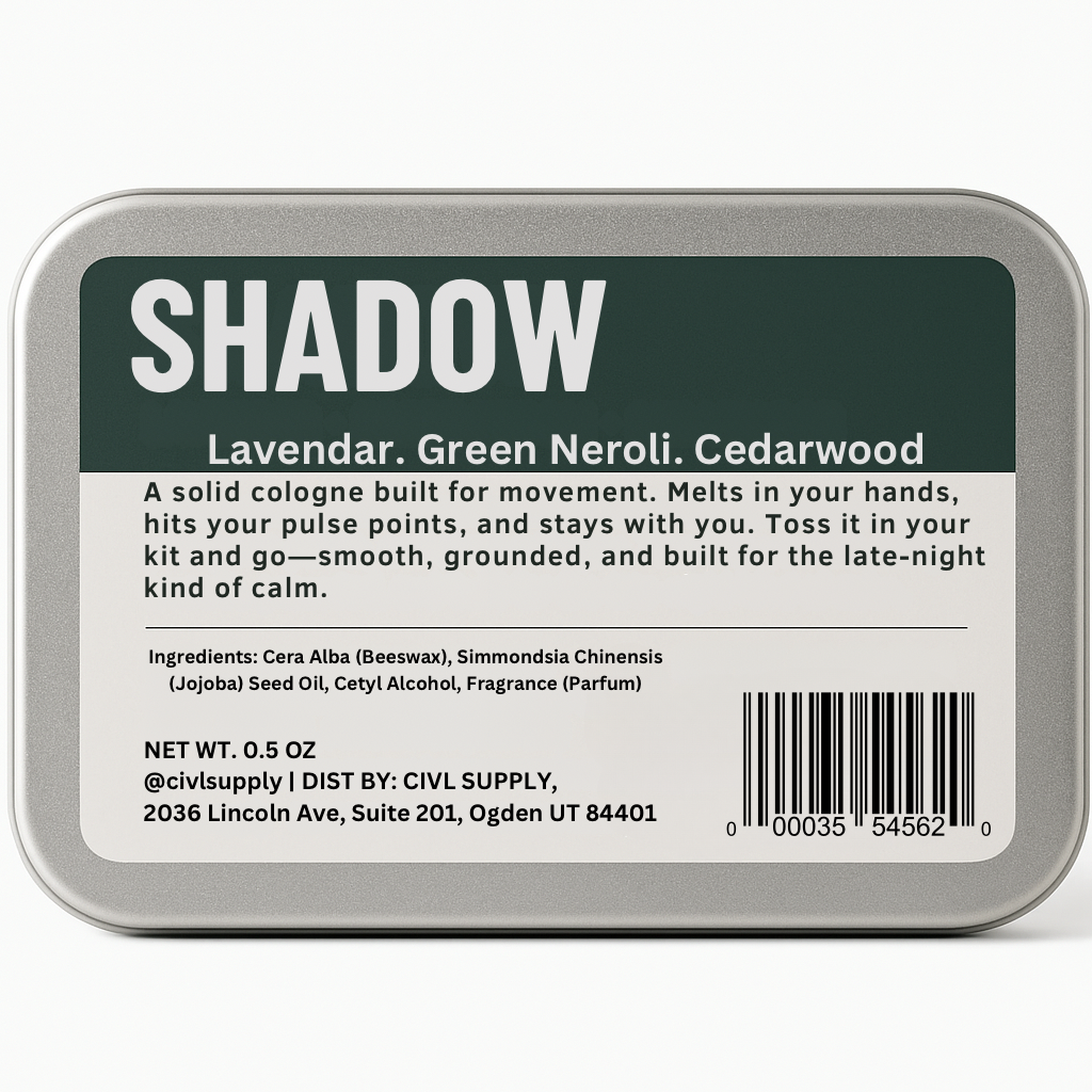 A small metal tin labeled 'SHADOW' containing solid cologne. The packaging is minimalistic with a green and black label, and the product is identified as 'CIVL Supply', 'Made in USA', with a net weight of 0.5 OZ