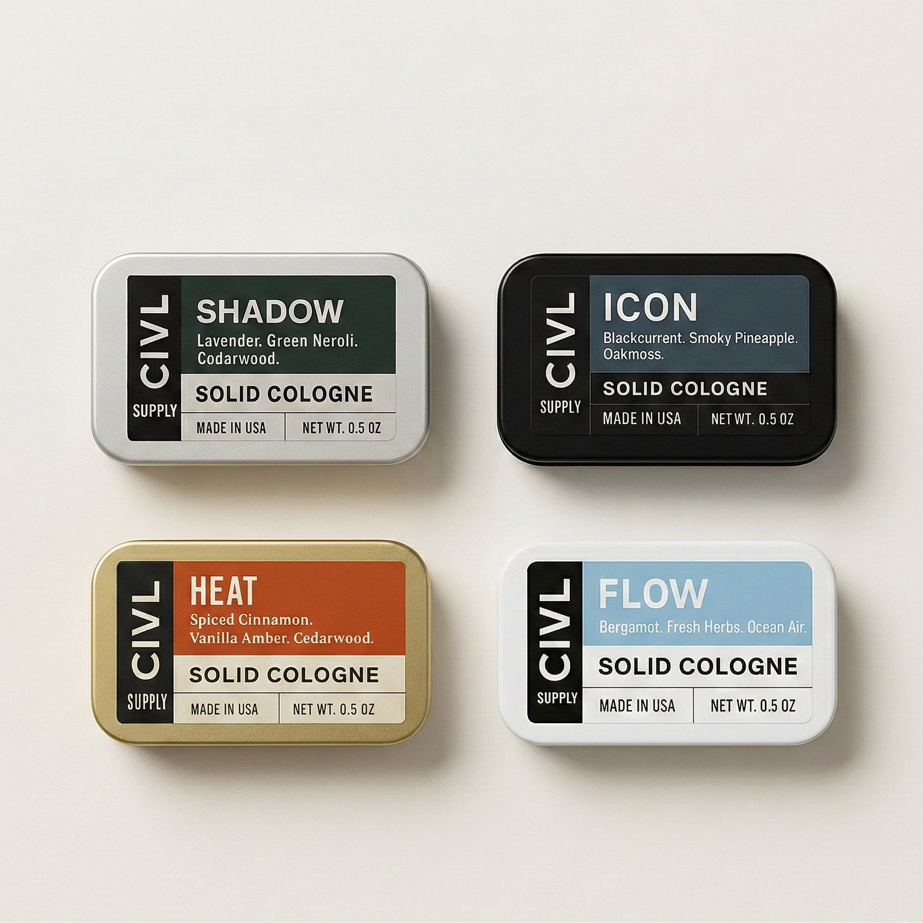 Four tins of Civil Supply solid cologne on a light background